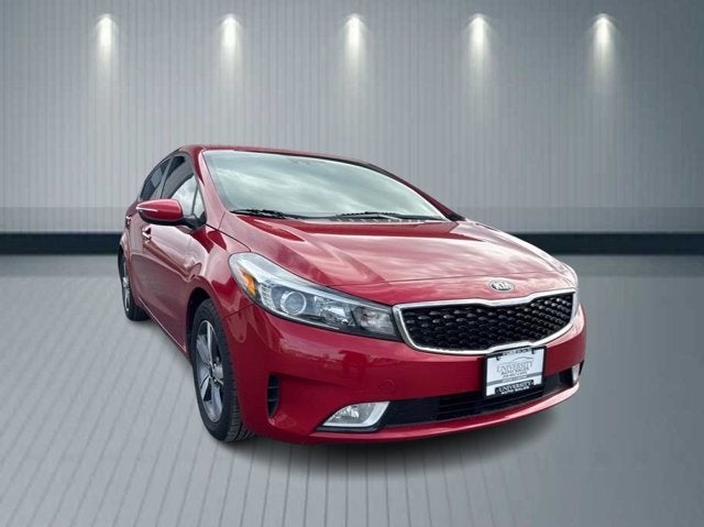 2018 Kia Forte S in Currant Red — front three-quarter view