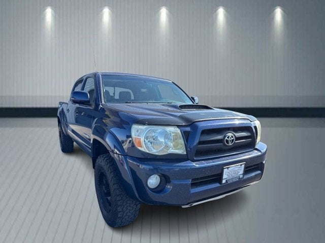 2005 Toyota Tacoma Pickup 4D 6 ft in Blue — front three-quarter view