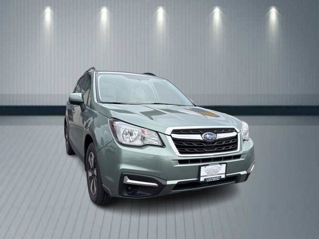 2018 Subaru Forester Premium in Jasmine Green Metallic — front three-quarter view